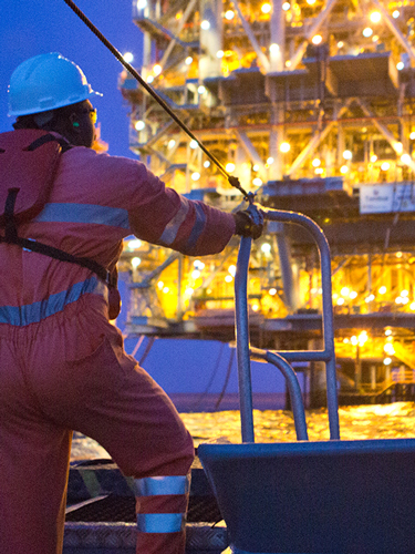 Chevron worker looking at offshore platform