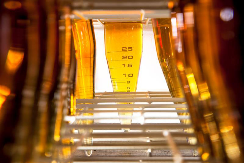 Close-up of lubricant samples in bottles in the laboratory at the Oronite Global Technology Center in Rotterdam, Netherlands.
