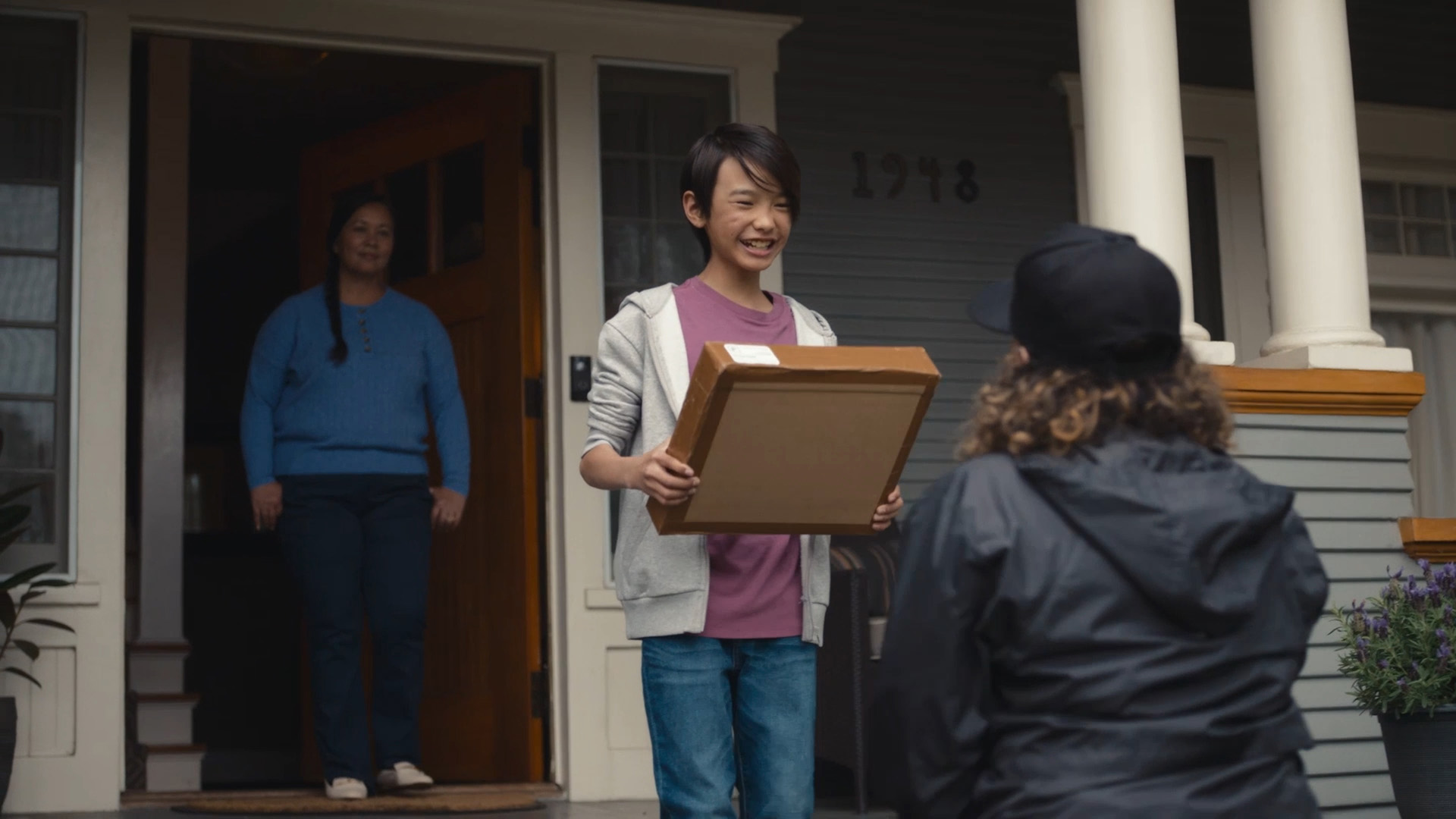 Photo of person receiving package delivery
