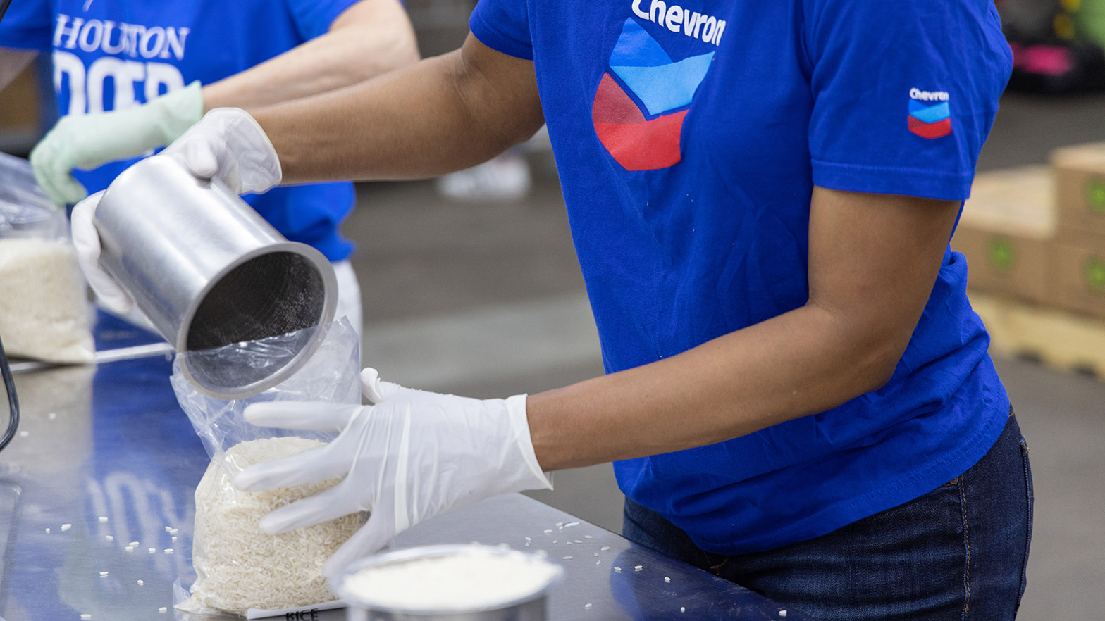 Chevron volunteer packs food