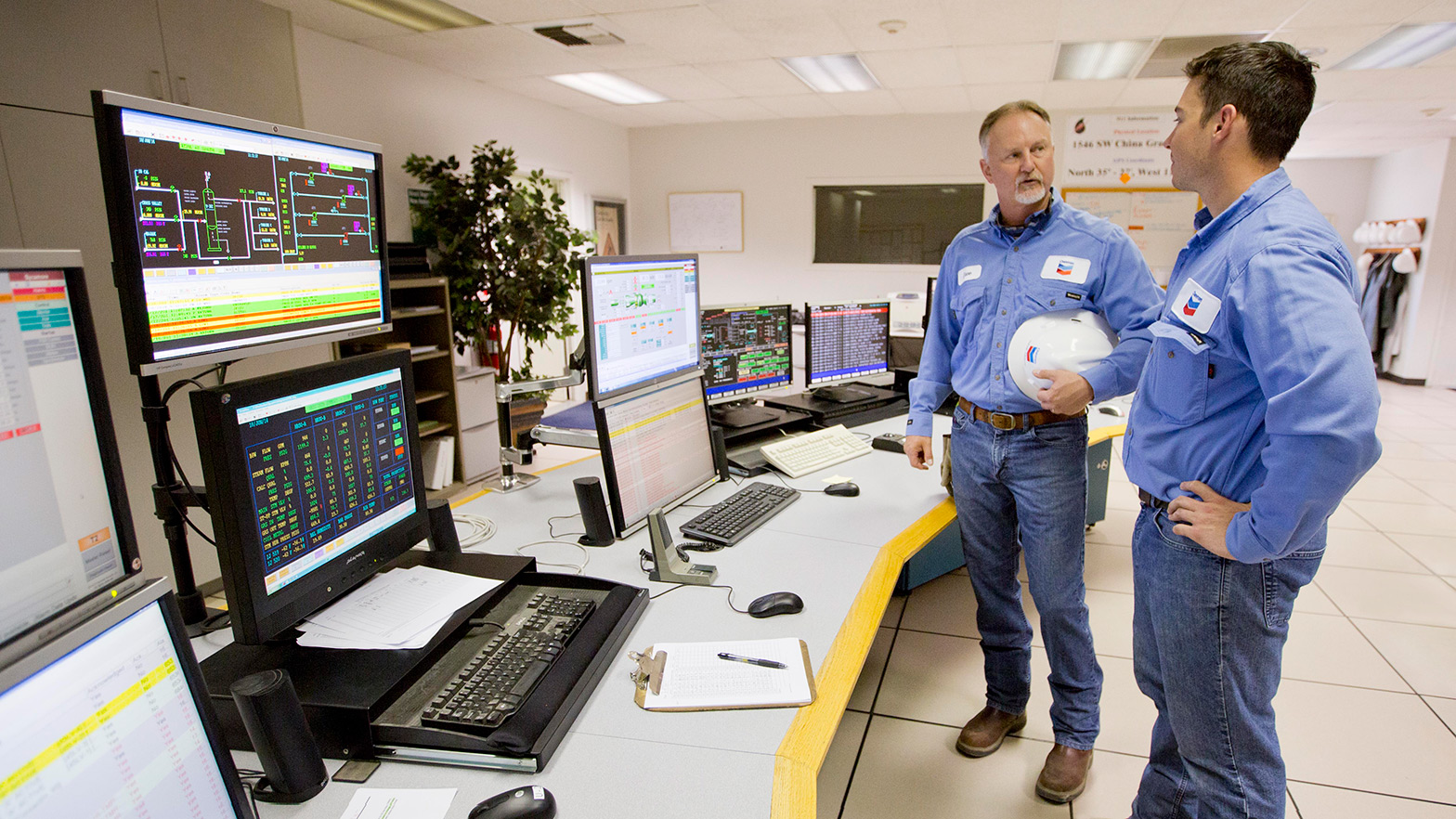 Workers in the control room at the Sycamore Cogeneration plant at Kern River Field in Bakersfield, California.
