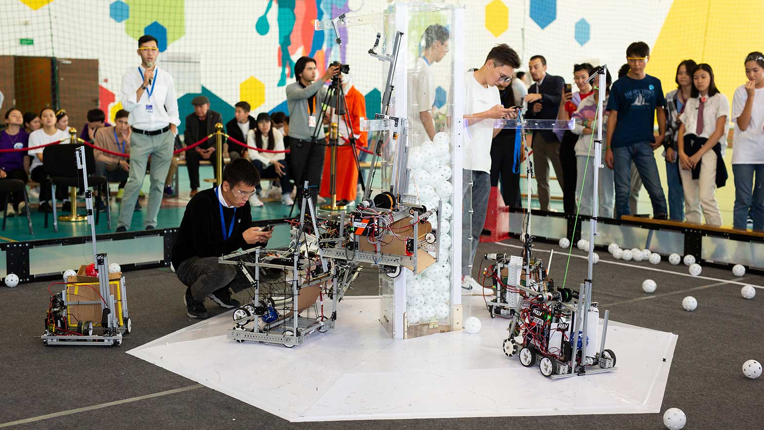 Mechanical robots being worked on by scientist