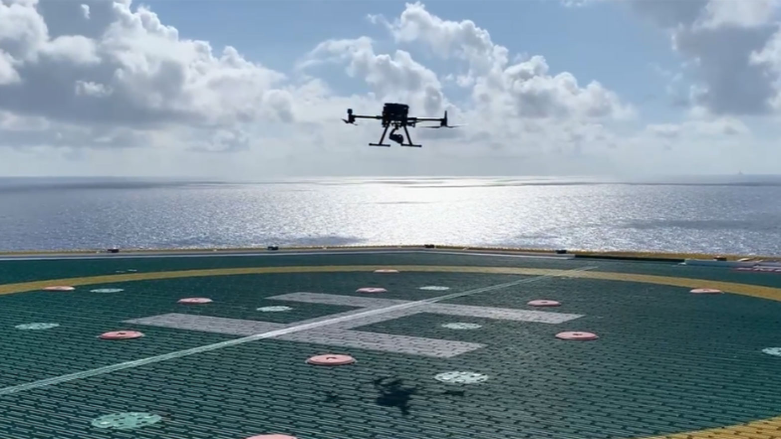 drone flying over sensors one the ocean to check for methane