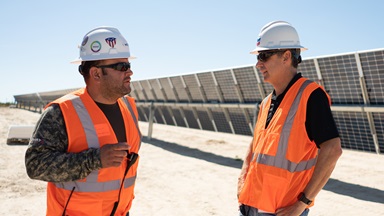 Colin Parfitt (right), Chevron’s vice president of Midstream, speaks with Joe Constante (left), a participant on a recent tour of the solar field.