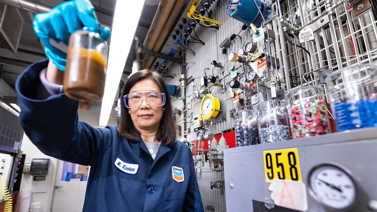 hye-kyung timken: principal scientist, chevron technical center, holding a flask