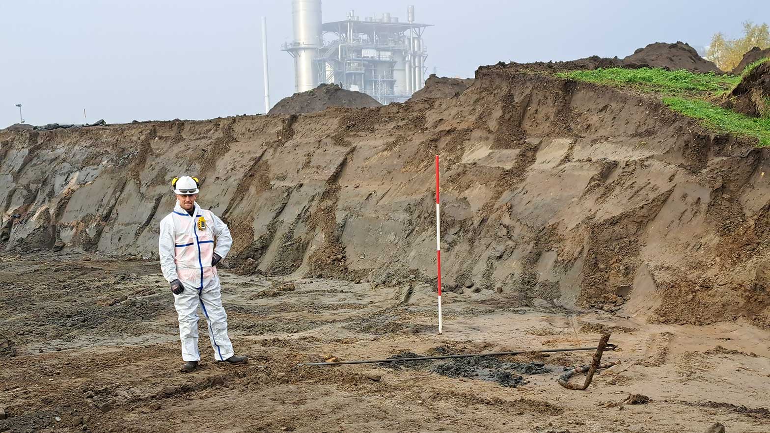 chevron employee looking at the ground marking a space