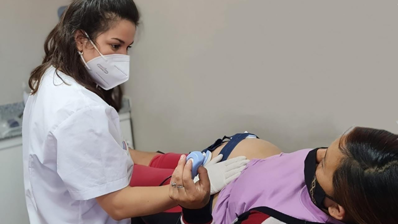 A health care professional tends to a pregnant patient in Rincón de los Sauces, Neuquén Province, Argentina.