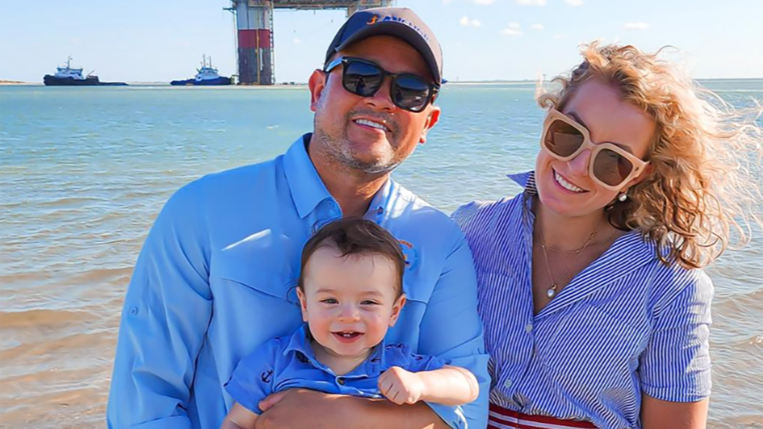 Isaias Rodriguez and wife, Kate, celebrate the Anchor sail away with son, James.