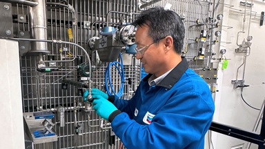 Chevron chemical engineer and technical leader Huping Luo commissions a new pilot scale unit for a methane catalytic cracking project.