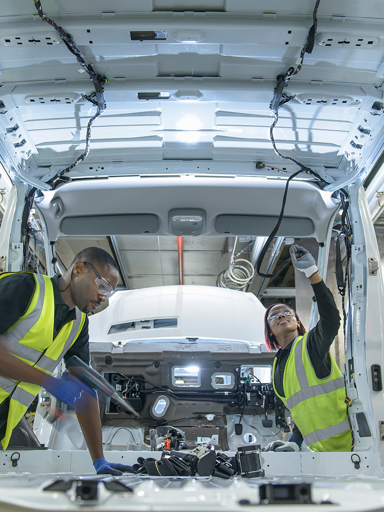 Two workers in yellow safety vests