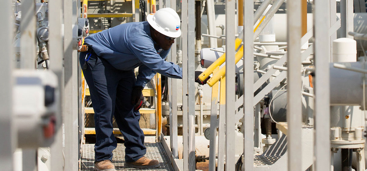 Chevron employee inspecting the pipelines 