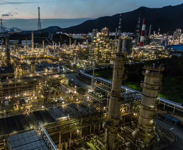 Modern, aerial view photo of refinery lights at night.