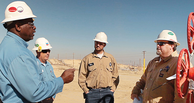 Four Chevron employees outdoors