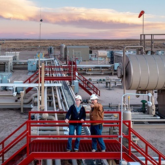 workers on a facility walkway
