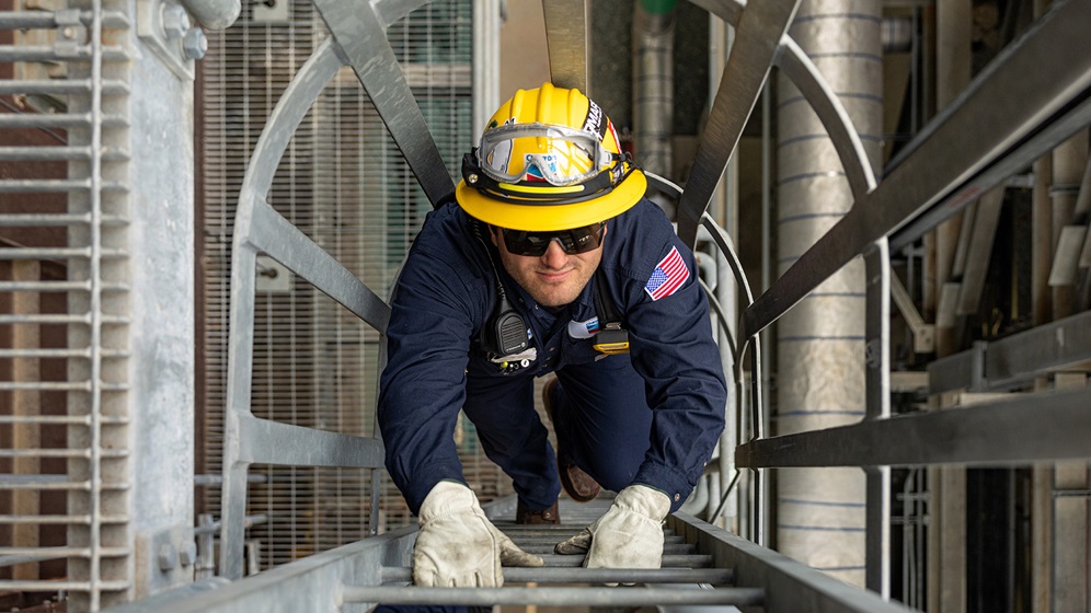 Operator climbing ladder in the H2 Plant at Richmond Refinery